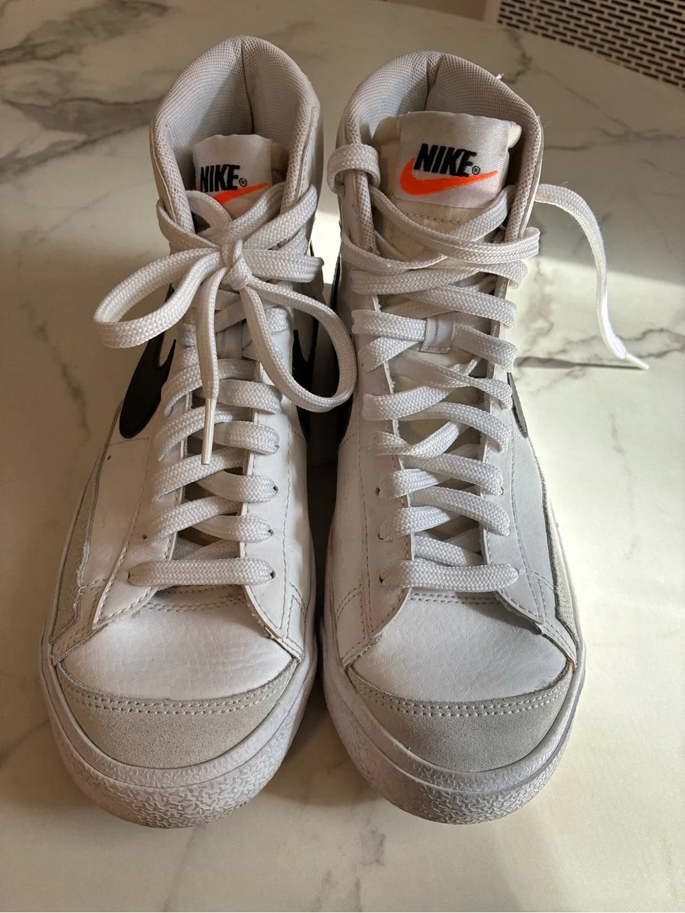 Nike White High-Top Sneakers with Black Swoosh Accent